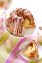 Ring cake with icing and chocolate glaze on easter table Royalty Free Stock Photo