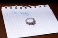 ring left on the night table, i\'m sorry message, close up Royalty Free Stock Photo
