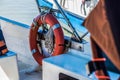 Ring life boy on big boat.Obligatory ship equipment.Personal flotation device.Prevent drowning.Orange lifesaver on the Royalty Free Stock Photo