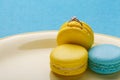 Hide a wedding ring in come to a macaroon. the offer to marry. place for text