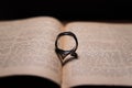 Ring in holy Bible - shadow forming a heart