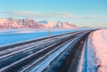 The Ring Road Route 1 on a sunny winter day along the snow-capped mountains between Hof and Jokulsarlon. South of Iceland Royalty Free Stock Photo
