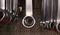 Ring Side Of Combination Wrenches In Front Of Perforated Metal Sheet Royalty Free Stock Photo