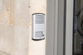 Ring surveillance video on modern house entrance with contemporary doorbell facade door
