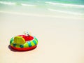 Ring Swim Inflatable Float Tube Rubber circle Summer Green on Sand Beach with Sea at Coast,for Family Tourism Child Vacation Royalty Free Stock Photo