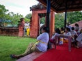 Balinese People In The Family Temple Waiting For Ceremonial Procession To Begin Royalty Free Stock Photo