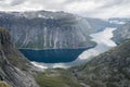 Ringedal lake viewed from Trolltunga, famous Norwegian landscape viewpoint. Hiking in Scandinavia. Cloudy autumn day in