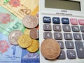 Ringgit Malaysia bank notes and coins with calculator. Royalty Free Stock Photo