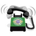 Ringing black stationary phone with rotary dial and flag of Brazil