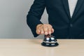 Ringing the silver service bell at the counter Royalty Free Stock Photo