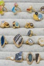 Rings with large gems in the window. Rings with different stones. vertical photo