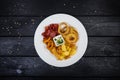 Rings of squid, onion rings, potato chips, salami chips with cheese sauce.