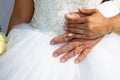 Rings for wedding bride and groom hands in white marriage dress background Royalty Free Stock Photo