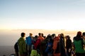 Hikers watching sunrise at the viewpoint of Mount Rinjani