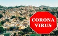 Rio de Janeiro, Brazil hillside shantytown also known as a favela with a Corona virus Covid-19 warning sign Royalty Free Stock Photo