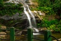 Beautiful waterfall called `Cascatinha Taunayon` on green nature in the Atlantic Rainforest, Tijuca Forest National Park Royalty Free Stock Photo