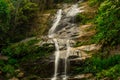 Beautiful waterfall called `Cascatinha Taunayon` on green nature in the Atlantic Rainforest, Tijuca Forest National Park Royalty Free Stock Photo