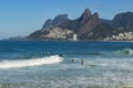 Surfers waiting for the perfect wave. Wonderful places in the world for s Royalty Free Stock Photo