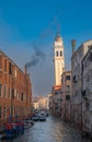 Rio dei Greci canal and the leaning bell tower of San Giorgio dei Greci Church in Venice, Italy