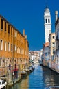 The Rio di San Cassiano Canal with boats and colorful facades of old medieval houses in Venice Royalty Free Stock Photo