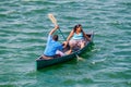 RIO DULCE, GUATEMALA - MARCH 10, 2016: Local indigenous people paddling across Rio Dulce river, Guatema Royalty Free Stock Photo