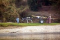 Rio Nilo, near Luxor, Egypt, February 21, 2017: Smiling Egyptian child carrying a loaded wagon and pulled by a donkey, with his fa