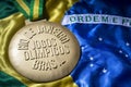 Rio 2016 Olympics Gold Medal on Brazil Flag Royalty Free Stock Photo