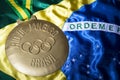 Rio 2016 Olympics Gold Medal on Brazil Flag Royalty Free Stock Photo