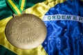 Rio 2016 Olympics Gold Medal on Brazil Flag Royalty Free Stock Photo