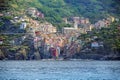 Riomaggiore, an ancient village with colorful houses from the Cinque Terre in the mountains on the Mediterranean sea coast, famous