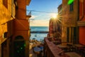 Riomaggiore city view, old village with colorful houses, sea and boats at sunset, Cinque Terre National Park, Liguria, Italy Royalty Free Stock Photo