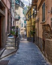 Picturesque narrow in old town of Riomaggiore, Cinque Terre, Italy