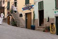 Riomaggiore street scene people and butcher\'s shop