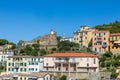 Ancient town of Riomaggiore, a town in the Cinque Terre in Italy. Castle with clock on top