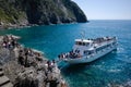 Tourists leave ferry boat down gangway in Cinque Terre National Park