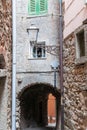 Riomaggiore narrow alleyway with street lamp and arch under home Royalty Free Stock Photo