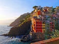 Riomaggiore, sunset view of bright houses on the Italian Riviera, Cinque Terre National Park
