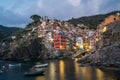 Riomaggiore town on Italian coastline at sunset in Cinque Terre, Italy