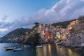 Riomaggiore town on Italian coastline at sunset in Cinque Terre, Italy