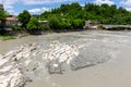 Rioni river in Kutaisi, landscape view with white stones from White Bridge, Georgia