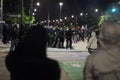 Riot police arresting protesters in Detroit