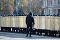 riot police squad with shields and helmets in the streets. police uniform to eliminate outbreaks in public places.