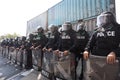 Riot police stand guard with shield to protect the government house Royalty Free Stock Photo