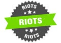 riots sign. riots round isolated ribbon label.