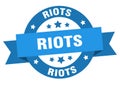 riots round ribbon isolated label. riots sign.