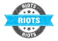 riots round stamp with ribbon. label sign