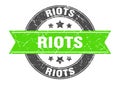 riots round stamp with ribbon. label sign
