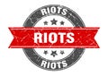 riots round stamp with ribbon. label sign