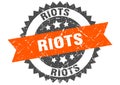 riots stamp. riots grunge round sign.