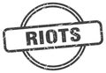 riots stamp. riots round vintage grunge label.